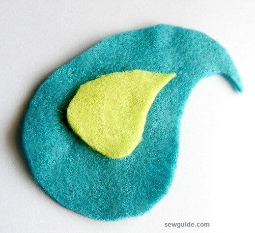 felt fabric kept in layers to make  a fabric beaded brooch 