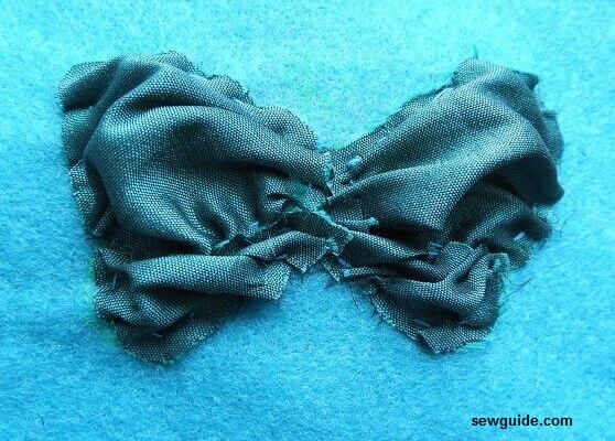 ruche the fabric in the shape of the design