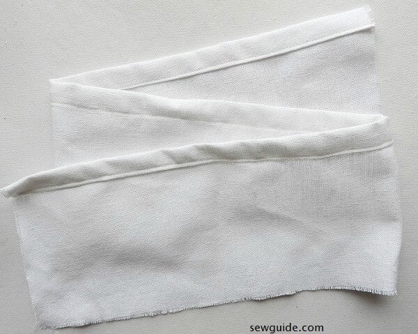 Sew the edges of 31 inches by 6 inch to the inside 