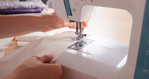 camera coming from the side at the back of the sewing machine