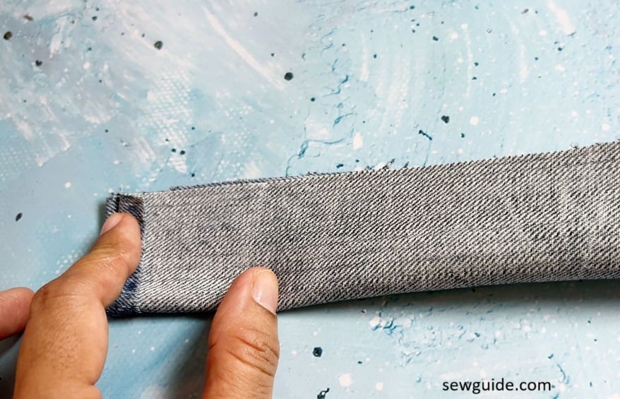 fold fabric strap by the middle