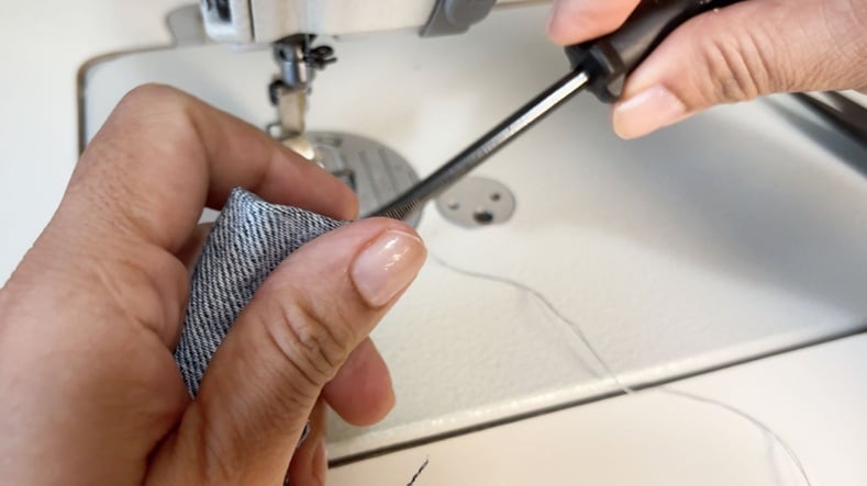 bring the top edge inside through the tube with screw driver