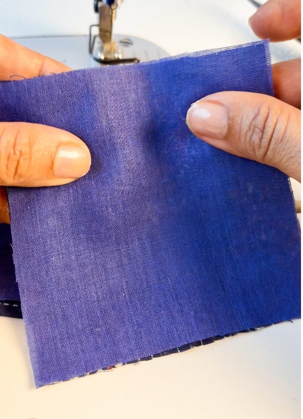 2 square fabric scraps stacked together