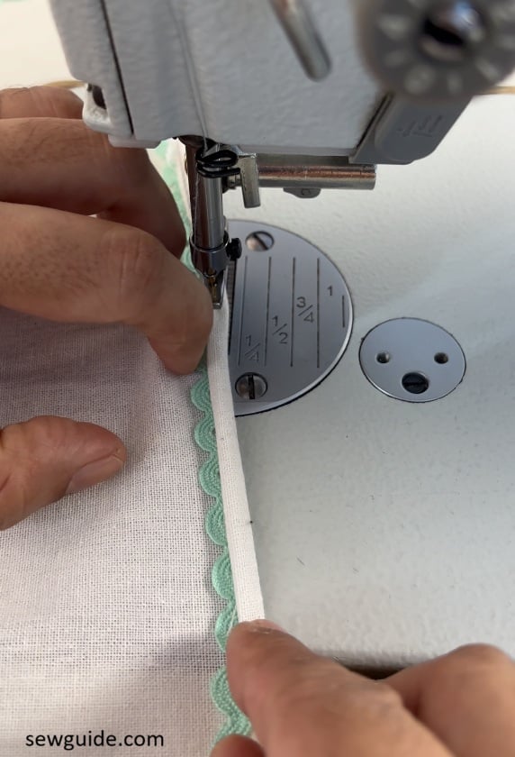 fold fabric edge over the ric rac trim