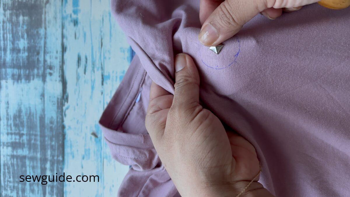 a stud attached on the tshirt