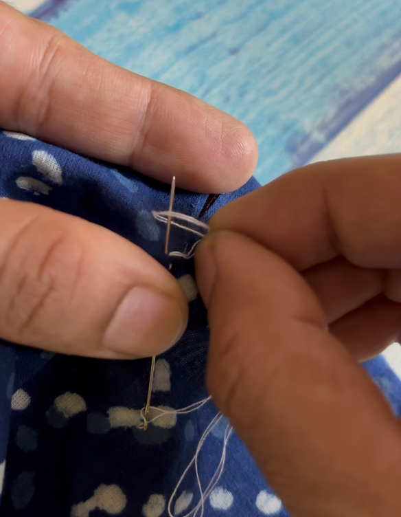 twist the thread and coil it over the needle