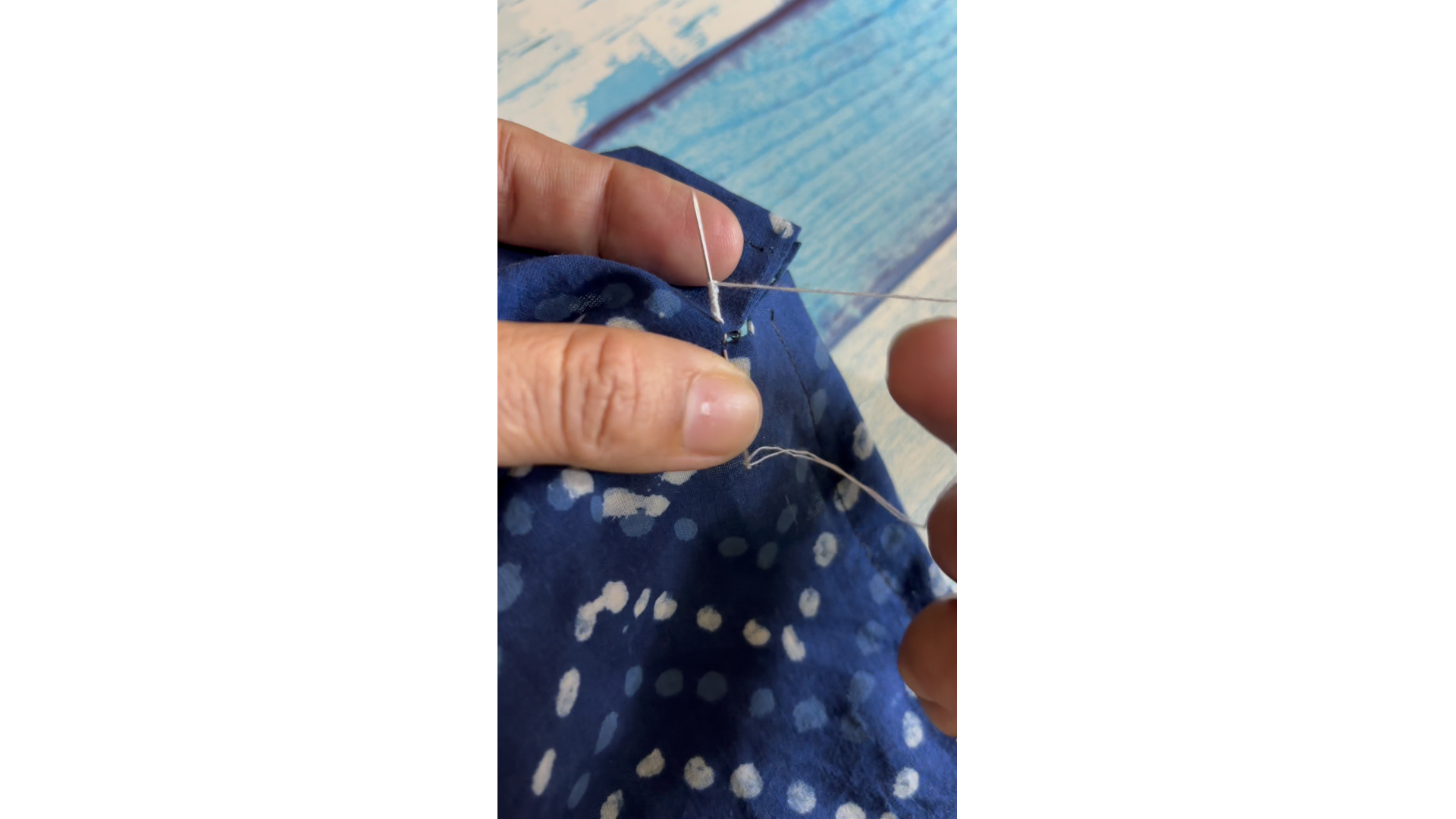 coiling thread around needle for the bar tack stitch