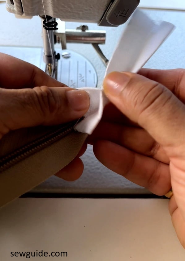 fold the tab into a triangle shape