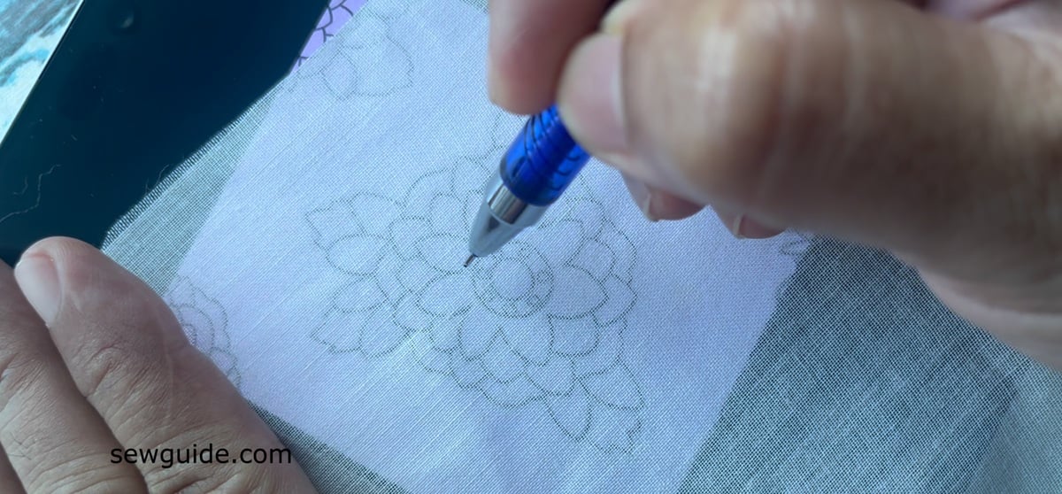 tracing an embroidery design with phone lightbox